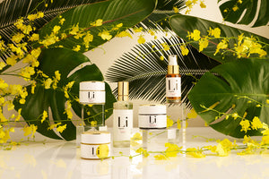 Nourishing Li Organics skincare surrounded by beautiful orchids, tropical botanicals, and beautiful light. Nourishing skincare rituals that delivers radiant results